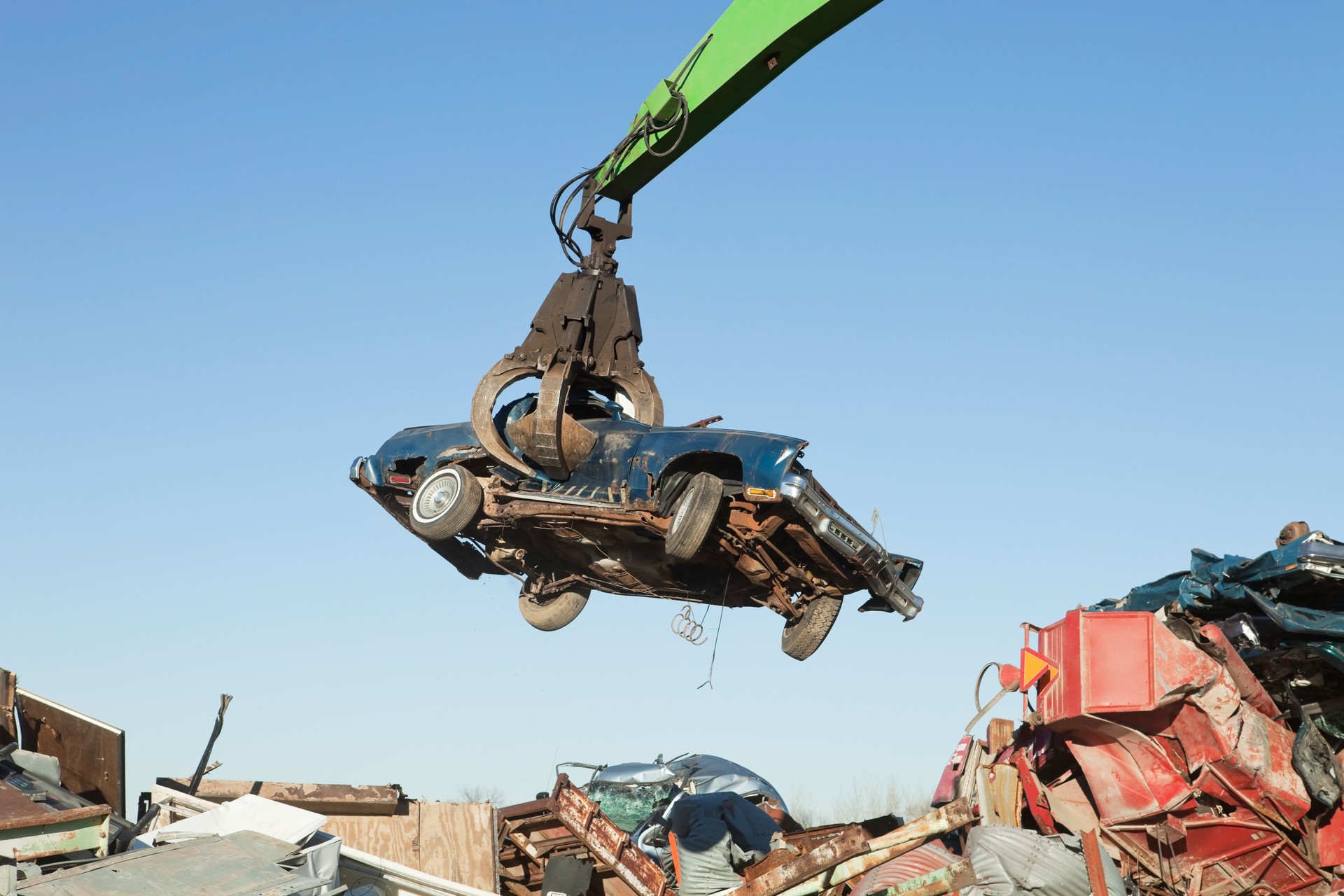 Salvage Yard Grappling Claw Gripping Scrap Car